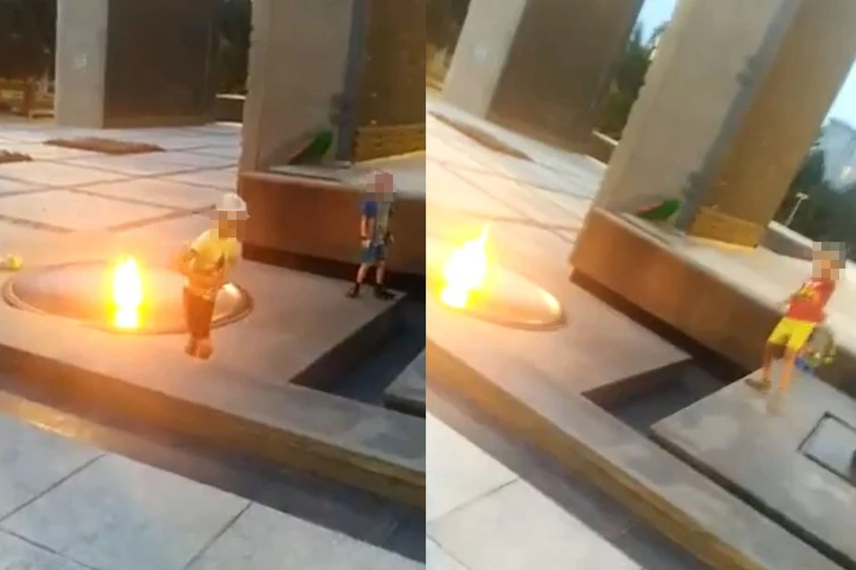 Дети забросали Вечный огонь монетами. Фото: скрин-шот с видео.